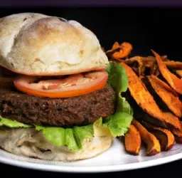 Imagen de deliciosa hamburguesa vegana de lentejas servida en un pan integral con lechuga